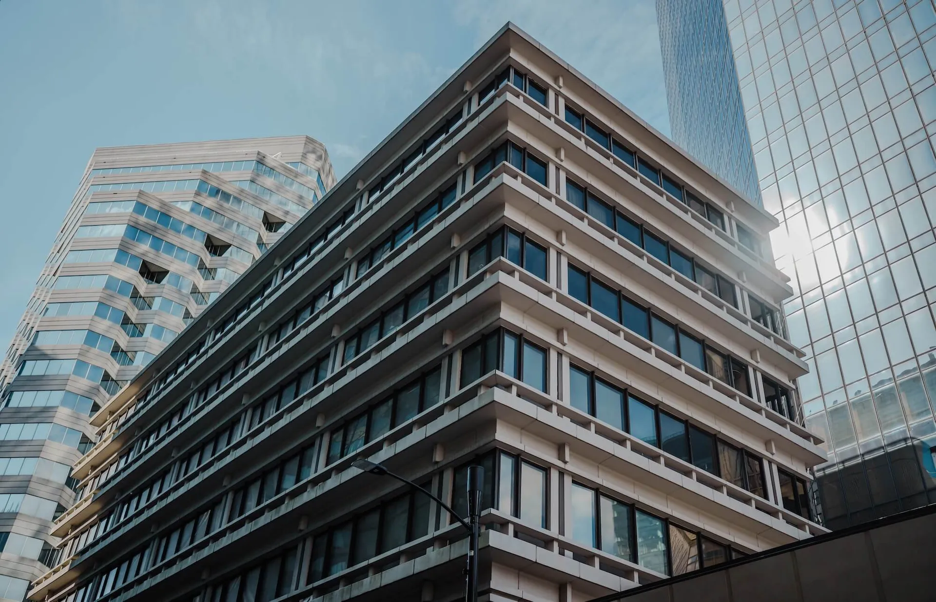 tall office building with glass windows in Uptown Charlotte