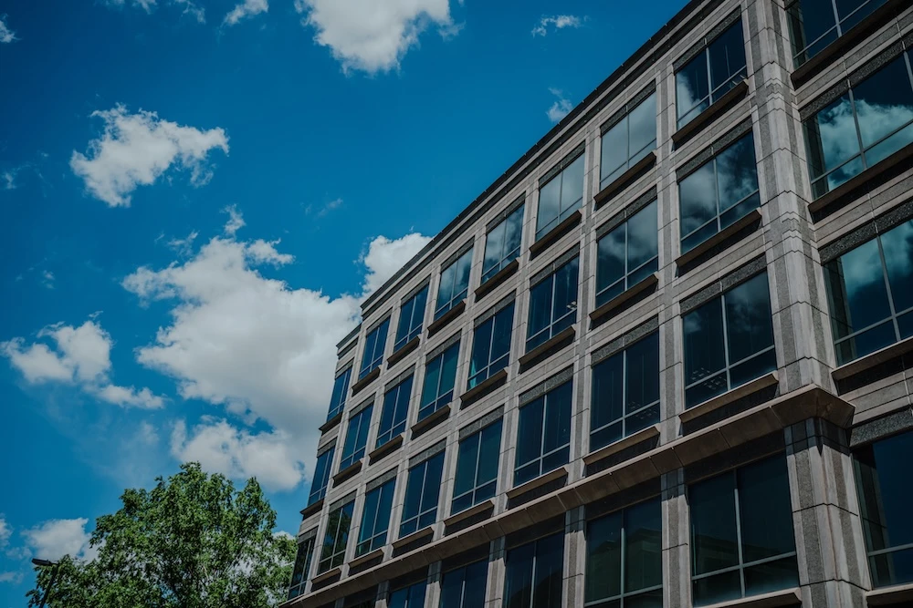 street view of glass window office building under blue sky
