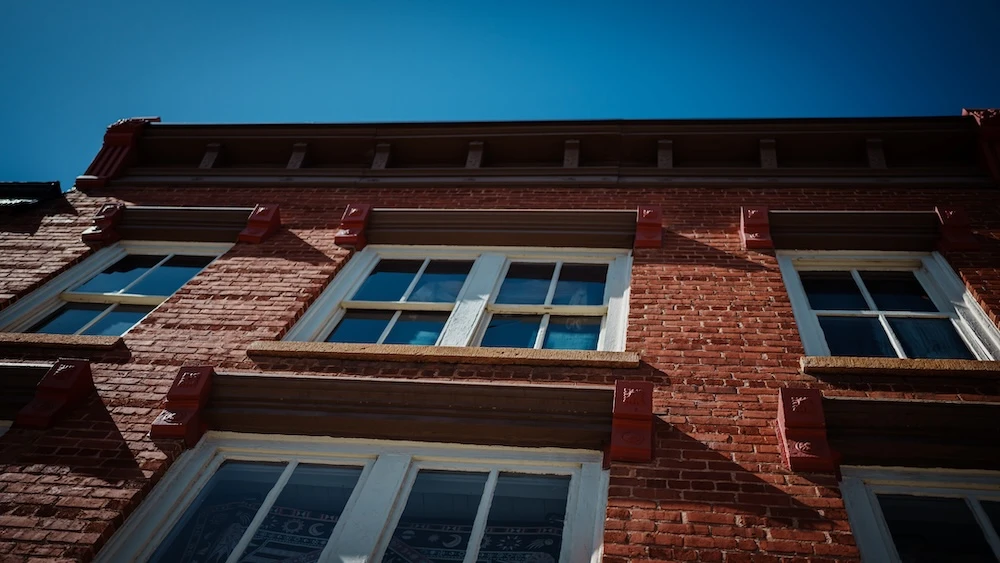 looking up at older building from street