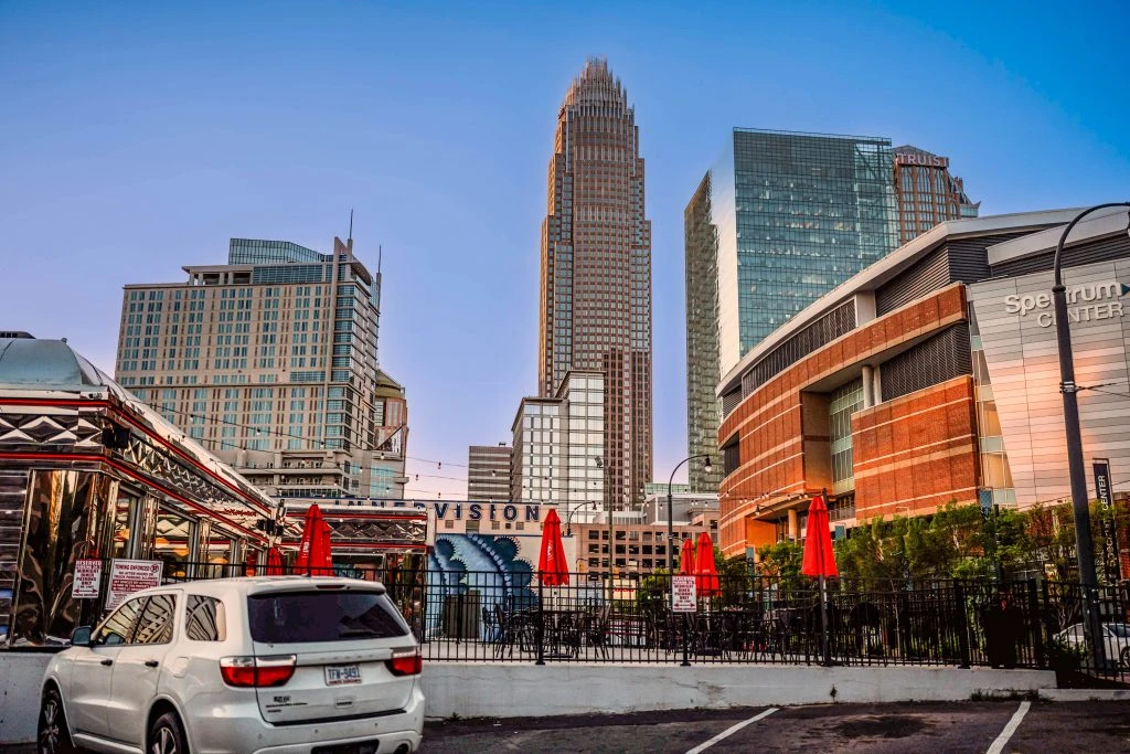 North Carolina map with a push pin in Charlotte: leave your mark in Charlotte's commercial real estate